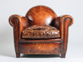 Fauteuil en cuir vieilli marron style wingback classique clouté design élégant salon
